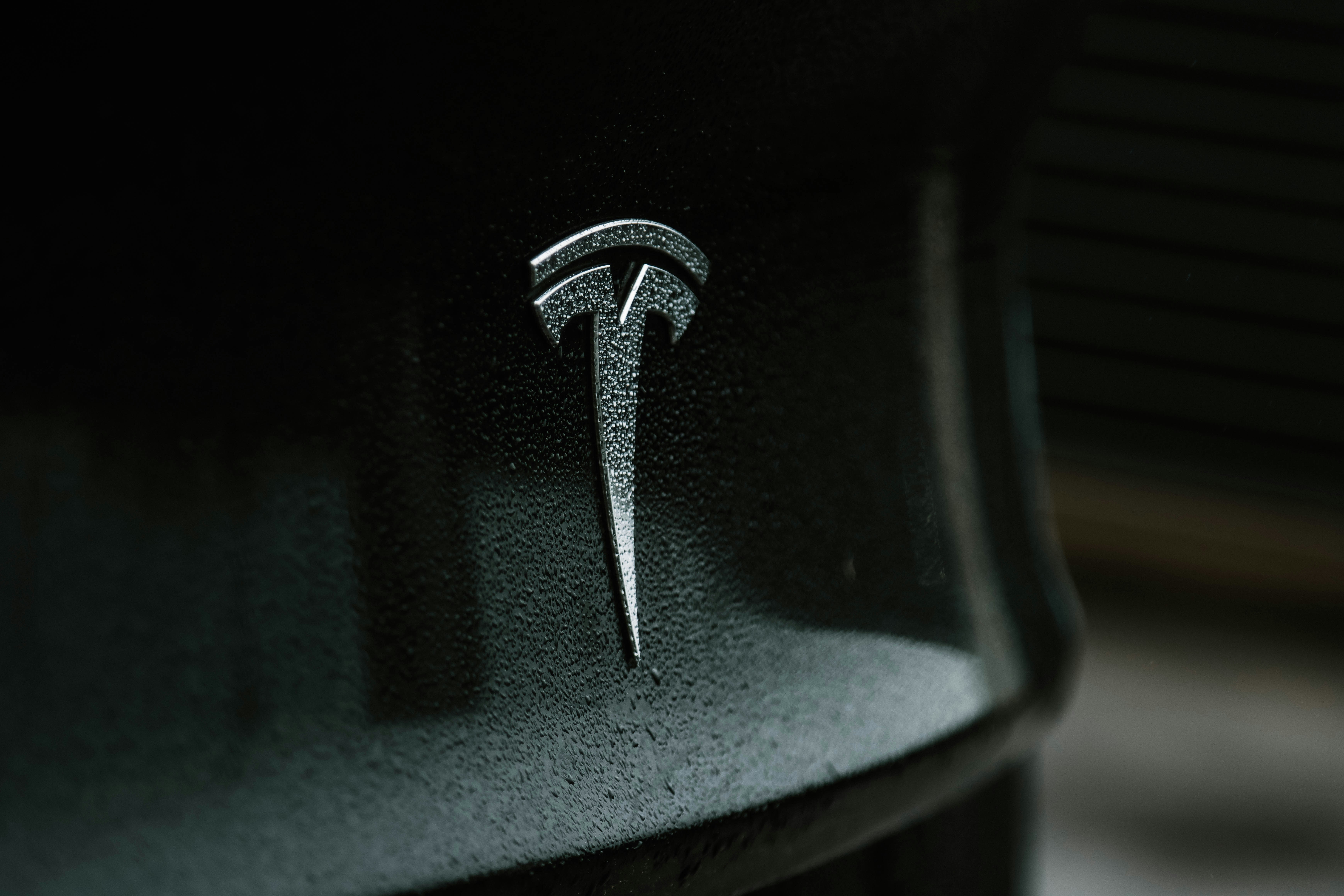 Tesla reports major layoffs due to low sales. Is its market position changing?
